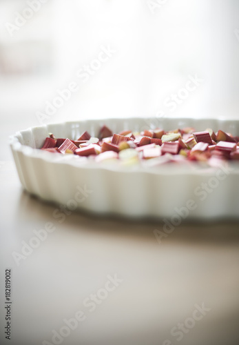 preparing a rhubarbpie in a platter