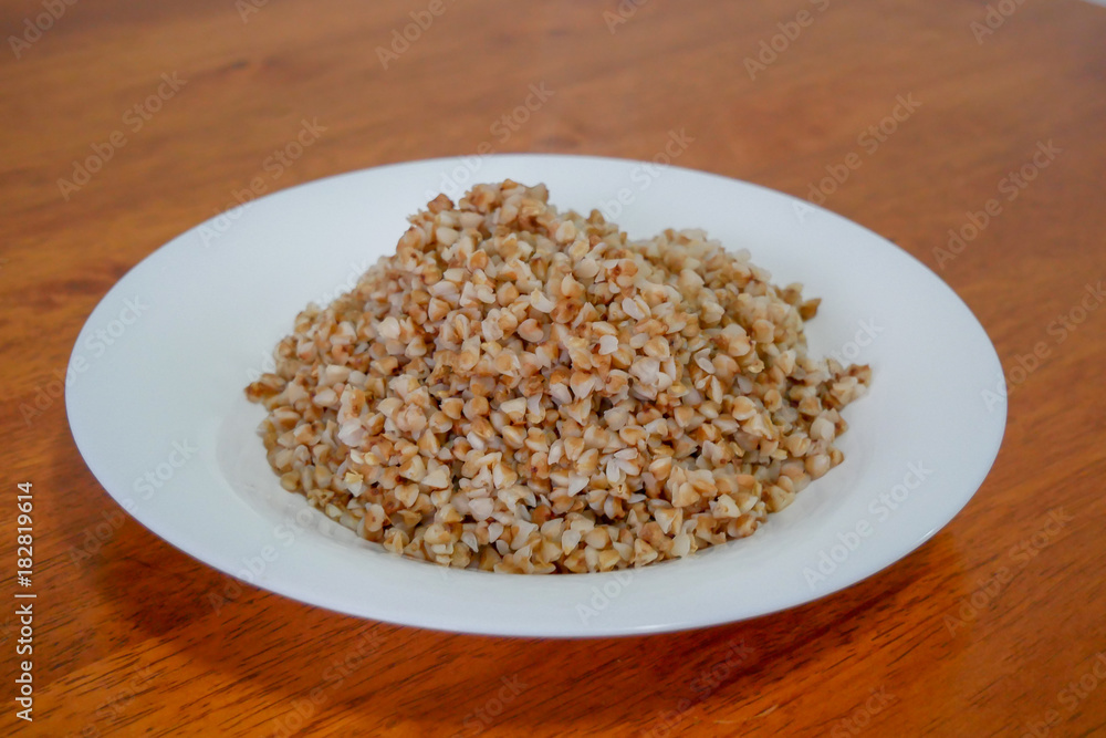 Buckwheat porridge in white plate. Healthy food. Buckwheat porridge in white plate. Healthy food.