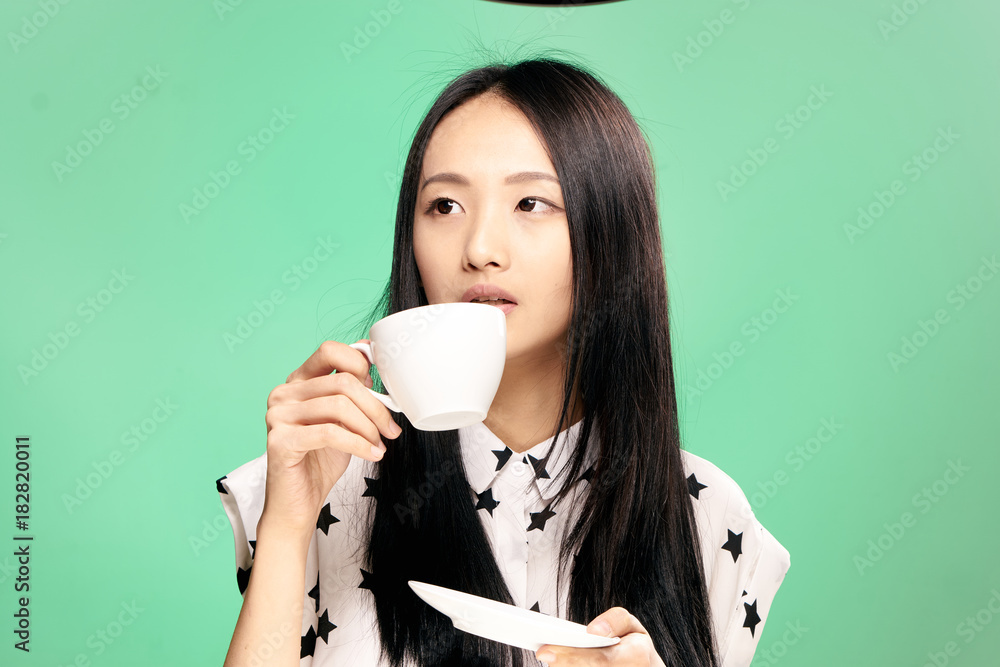 Εκτύπωση καμβά 2043186 Woman drinking from mug, woman with mug, woman on green background