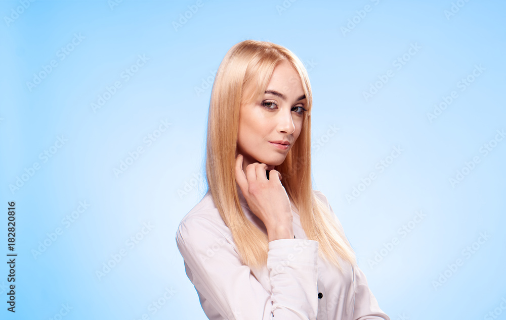 2043243 Beautiful young woman on a blue background, portrait 2043243 Beautiful young woman on a blue background, portrait