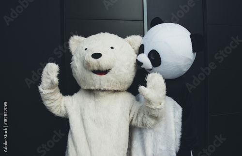 Panda and teddy bear having fun around the city