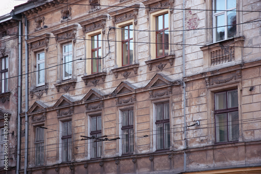 Beautiful exterior of houses in the city of Lviv. Gothic. Beautiful buildings on the streets. Old windows.