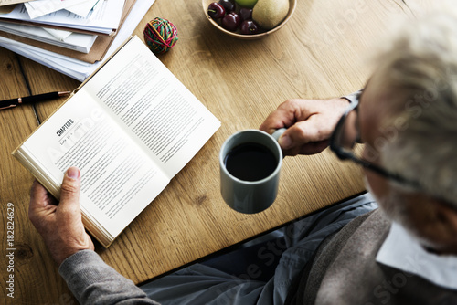 Old man reading a book