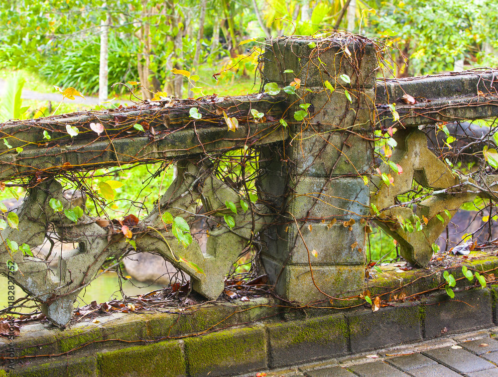 Fotografie Old suspension bridge based on stone pillars.