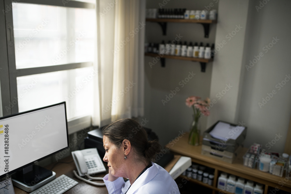 A doctor checking medicine stock A doctor checking medicine stock