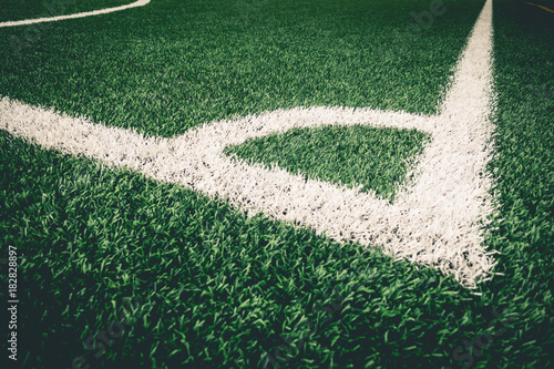 Obraz na plátně Corner kick white line on artifact grass for soccer training