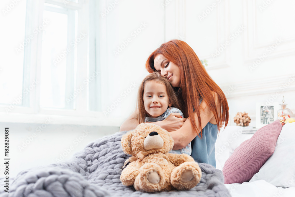 A little cute girl enjoying, playing and creating with toy with mother A little cute girl enjoying, playing and creating with toy with mother