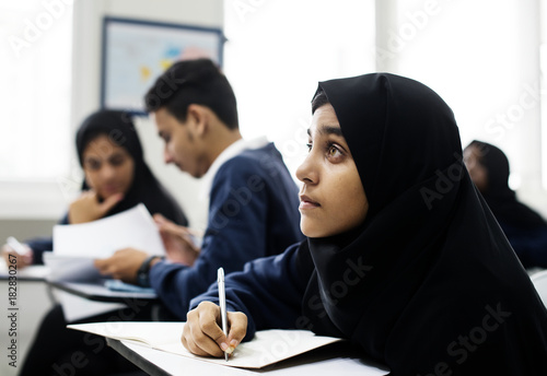 Photography Diverse Muslim children studying in classroom