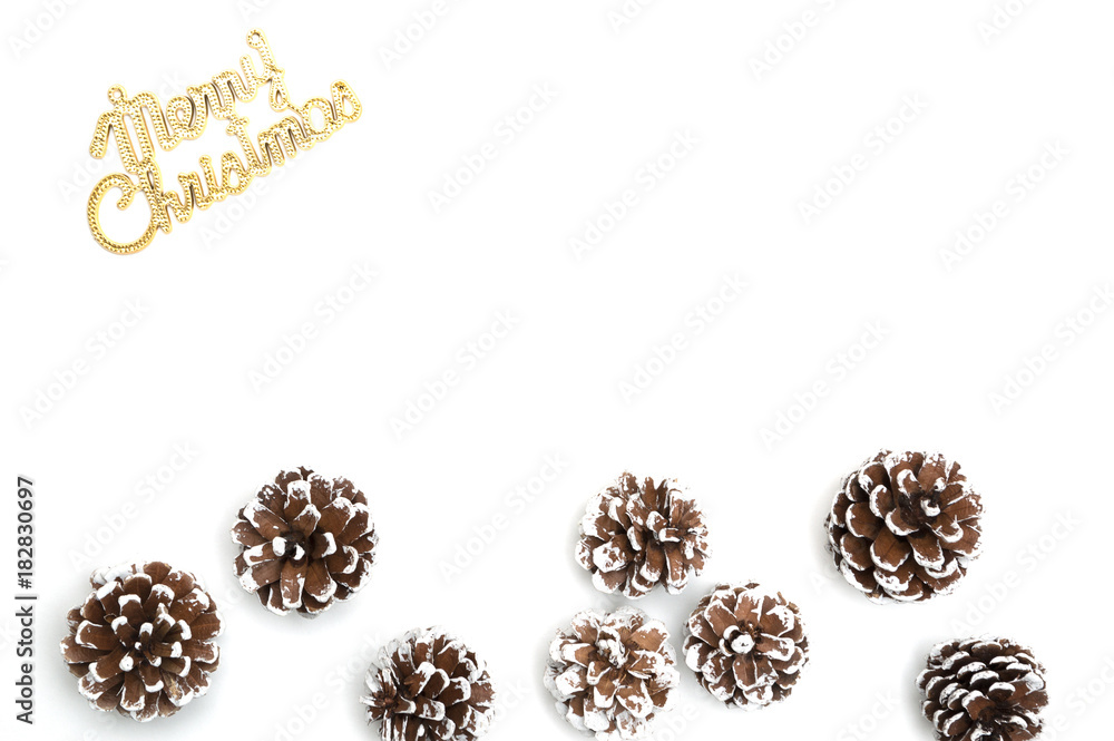 Merry christmas text and pine cone on white background Merry christmas text and pine cone on white background