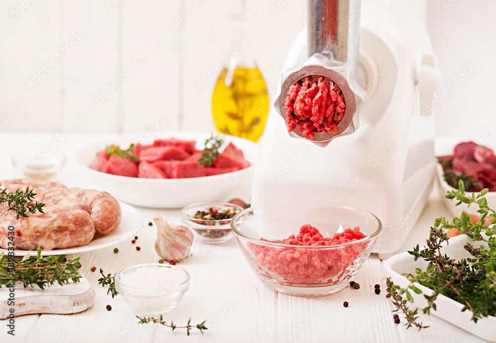 Chopped raw meat. The process of preparing forcemeat by means of a meat grinder. Homemade sausage. Ground beef. Chopped raw meat. The process of preparing forcemeat by means of a meat grinder. Homemade sausage. Ground beef.
