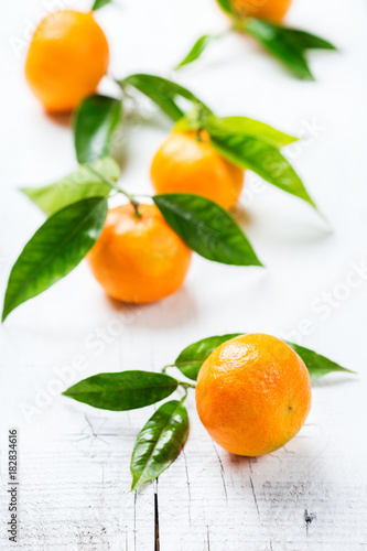 Organic healthy tangerine mandarine on a white wooden table
