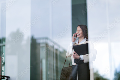 Portrait of young beautiful businesswoman going to office