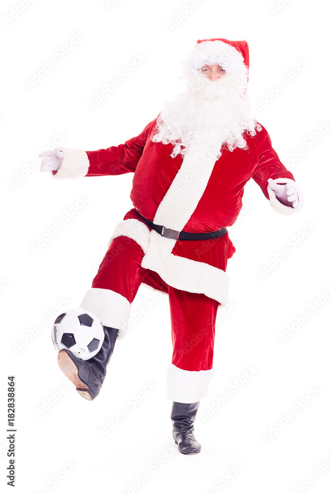 Portrait of Santa Claus playing soccer ball on white background Portrait of Santa Claus playing soccer ball on white background