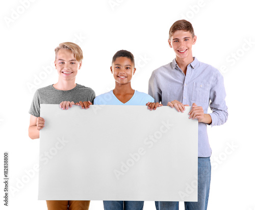 Teenagers with blank poster...