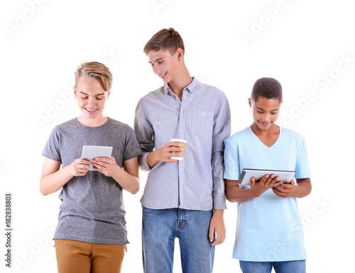 Teenagers with tablet compu...