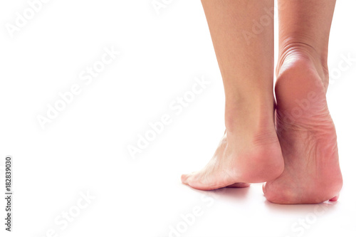 female feet stand on toes