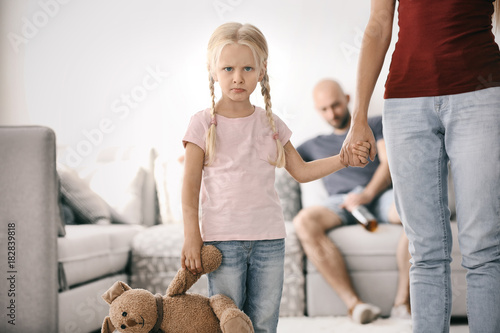 Young woman and little girl...