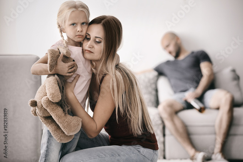 Young woman and little girl...