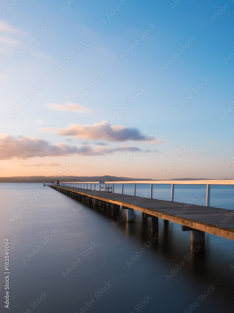 An empty long jetty view during sunset.