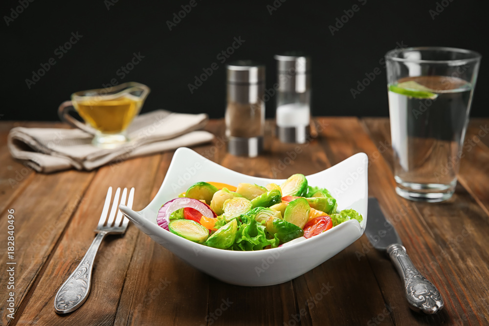 Plate of salad with Brussels sprouts on table