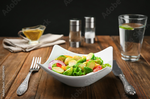 Plate of salad with Brussels sprouts on table