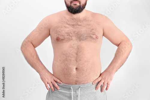 Overweight young man on lig...