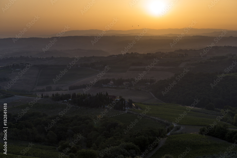 Sunset over the hills of Siena in Tuscany
