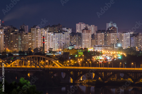 Railway bridge over Dnipro and view of the residential area of Kiev