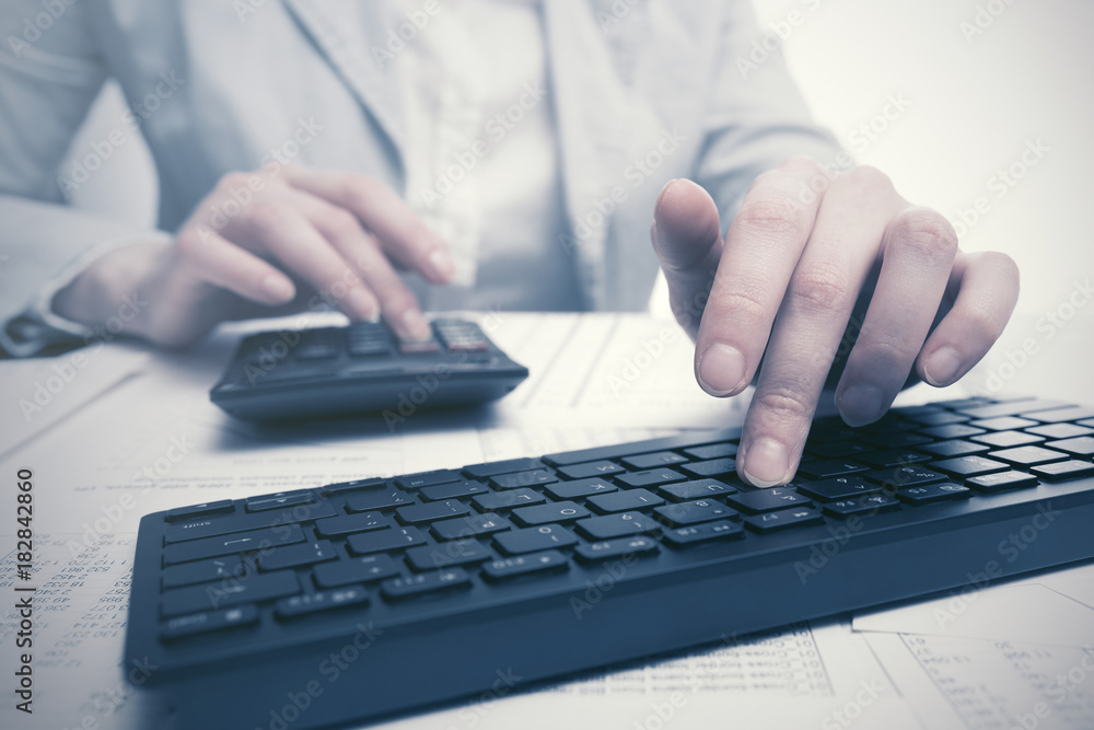 Financial accounting Business woman using computer keyboard Financial accounting Business woman using computer keyboard