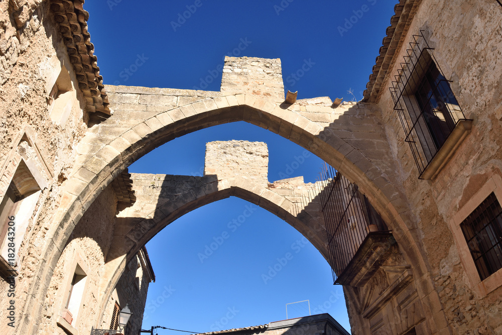 arch in the street of the village of Vallbona de les Monges, Llieda province, Catalonia, Spain
