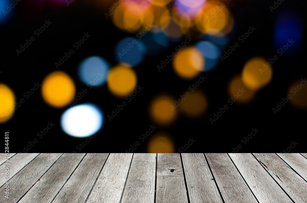 wooden terrace or desk with copy space for display of product or object presentation with bokeh light in the city at night