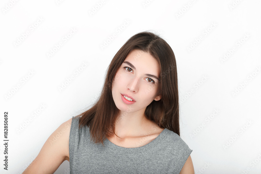 Excited happy looking woman. Closeup of happy mixed race asian caucasian female model isolated on white background. Excited happy looking woman. Closeup of happy mixed race asian caucasian female model isolated on white background.