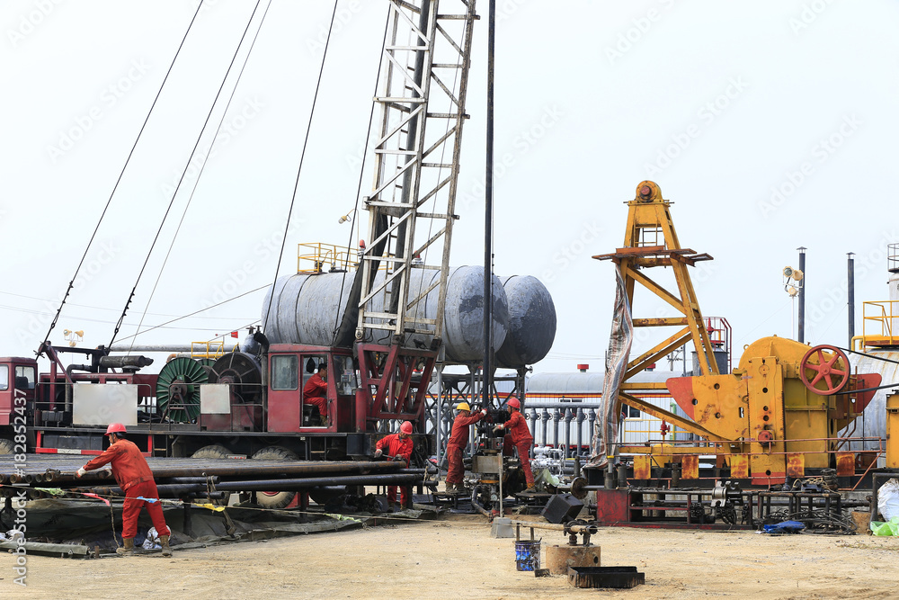 Oil workers are working at the oil fields