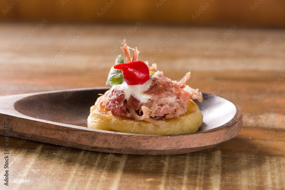 blinis of puba dough, smoked meat, coriander and minced pepper blinis of puba dough, smoked meat, coriander and minced pepper