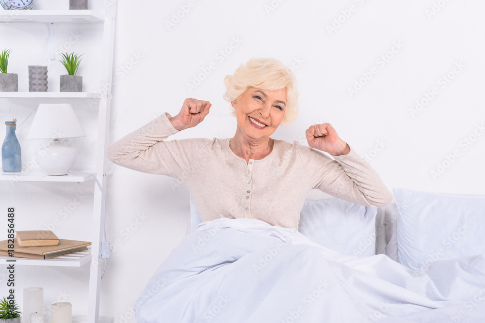 portrait of cheerful senior woman resting in bed at home portrait of cheerful senior woman resting in bed at home