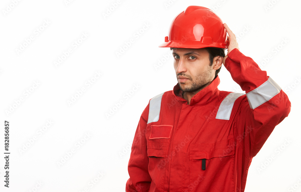 Young construction worker builder in red hard hat