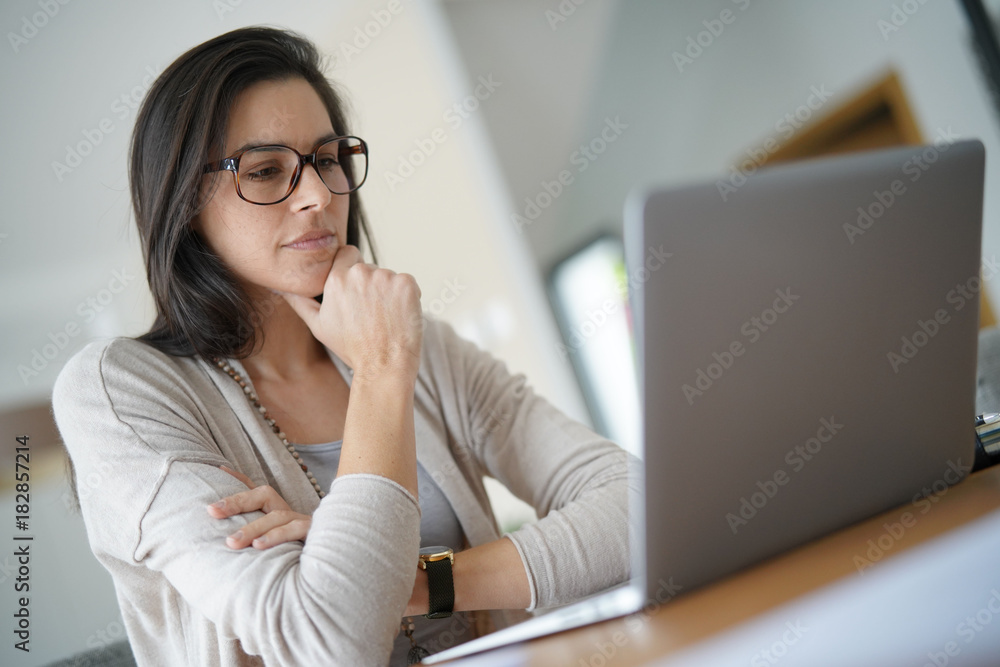 Woman working from home on laptop computer Woman working from home on laptop computer