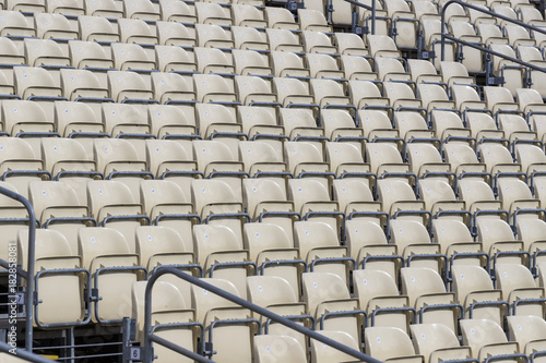 Rows of plastic chairs for spectators in the stands
