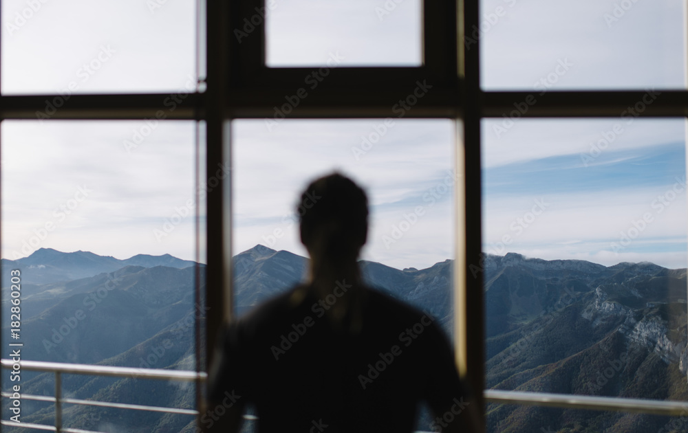 young guy looking to the mountains young guy looking to the mountains