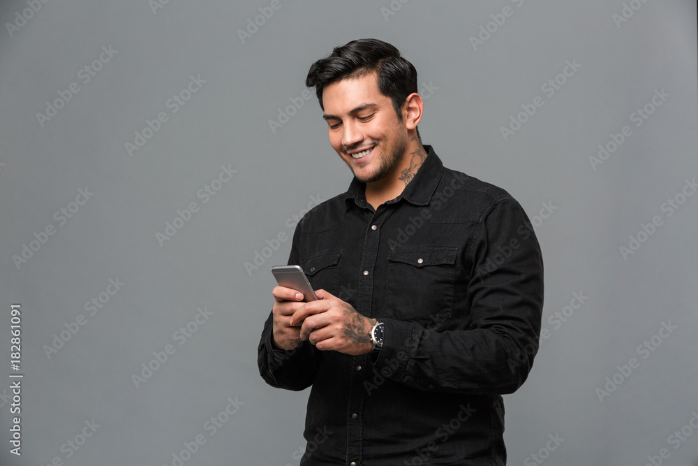 Cheerful young handsome man standing isolated Cheerful young handsome man standing isolated