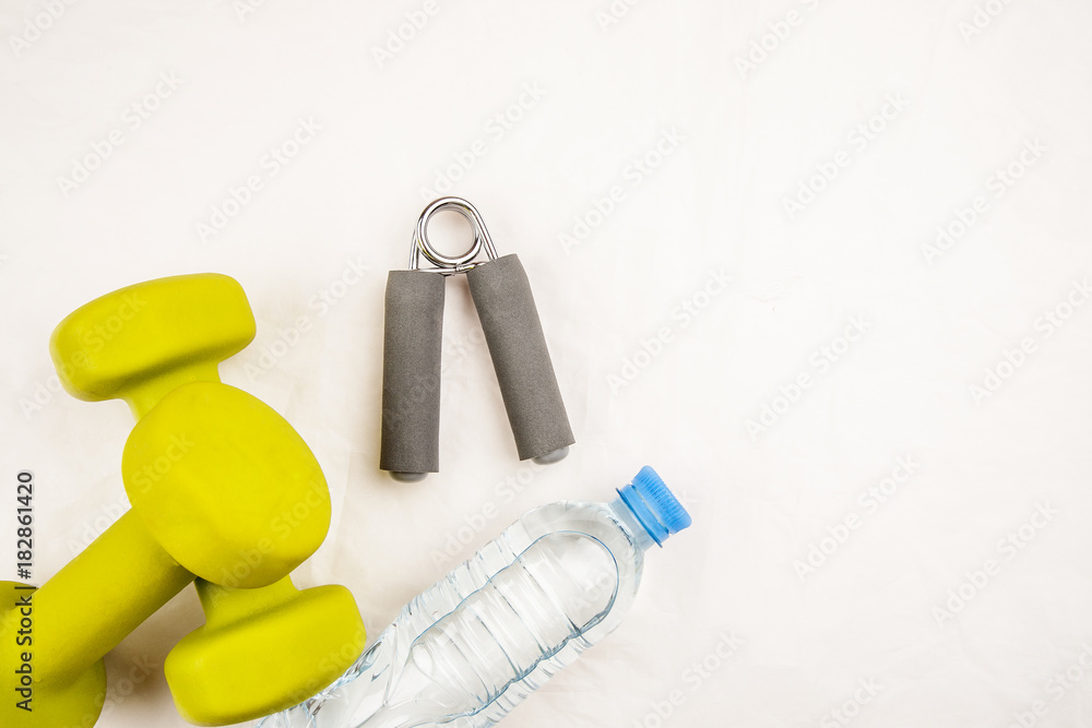Sports equipment with bottle of water on a white background top view Sports equipment with bottle of water on a white background top view