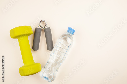 Sports equipment with bottle of water on a white background top view