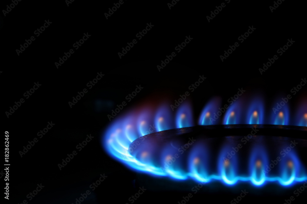 Gas burning in the burner over black background. Gas burning in the burner over black background.