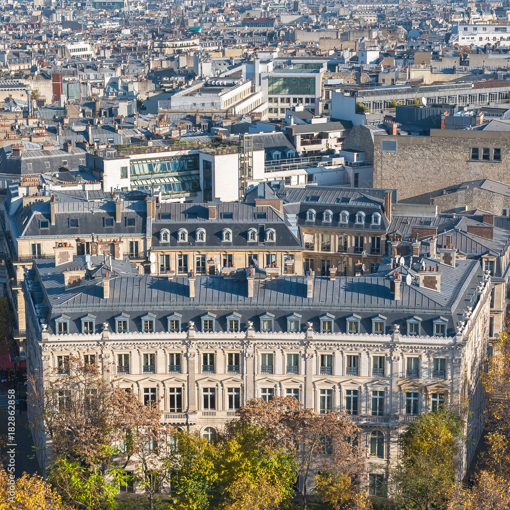 Paris, beautiful Haussmann facades and roofs in a attractive area of the capital, view from the triumph arch

