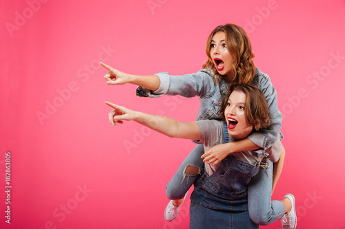 Bild auf Leinwand Emotional amazing two women friends have fun