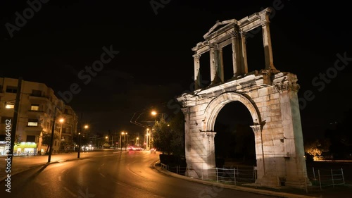 Night Athens. On right we see the Arch of Hadrian that leads to the pillars of Zeus's archaeological site. photo