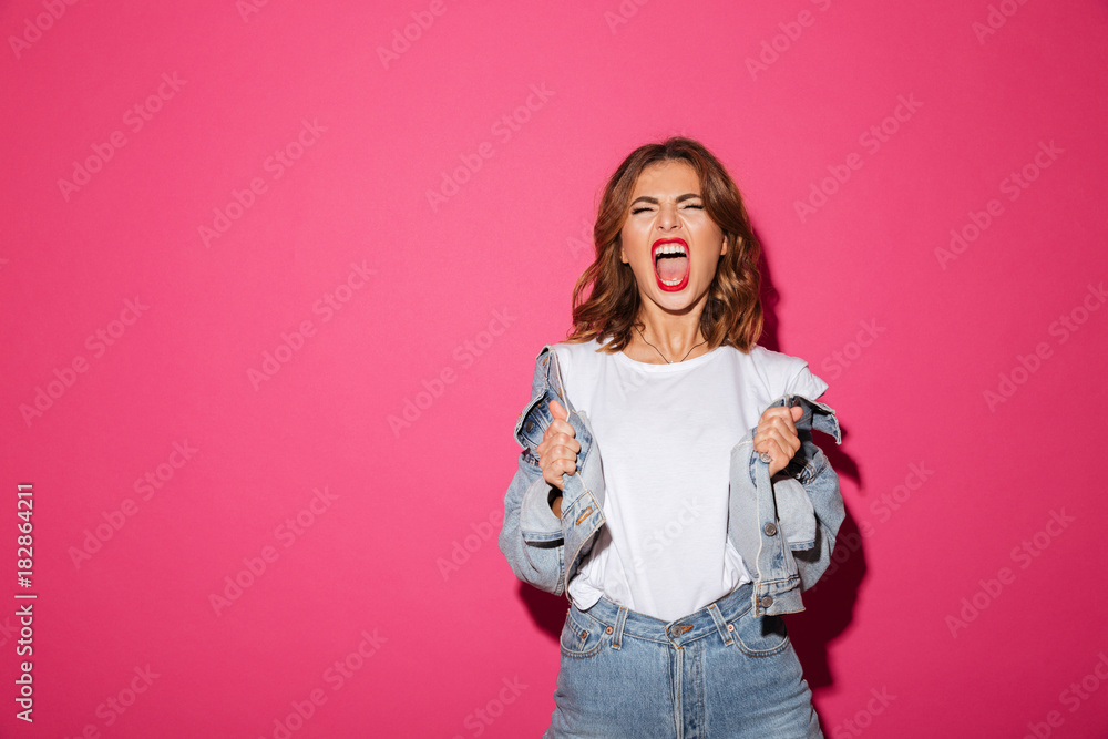 Screaming young woman isolated over pink background. Screaming young woman isolated over pink background.