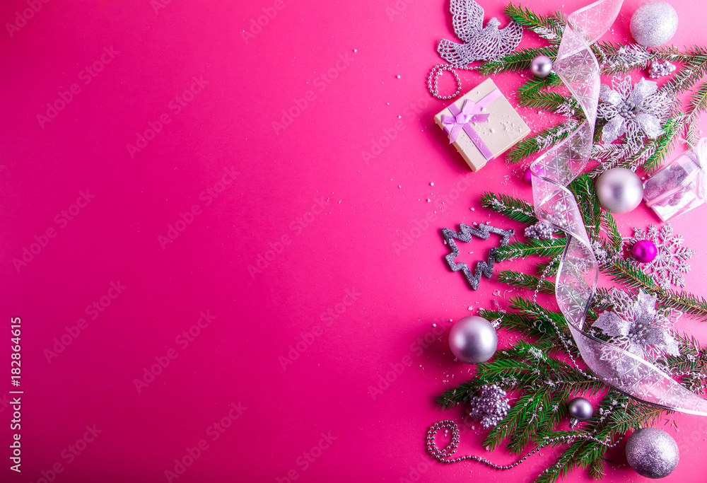 Pink Christmas background with a present and decorations Stock Photo