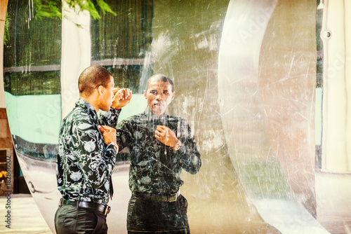 Photography Man looking at mirror