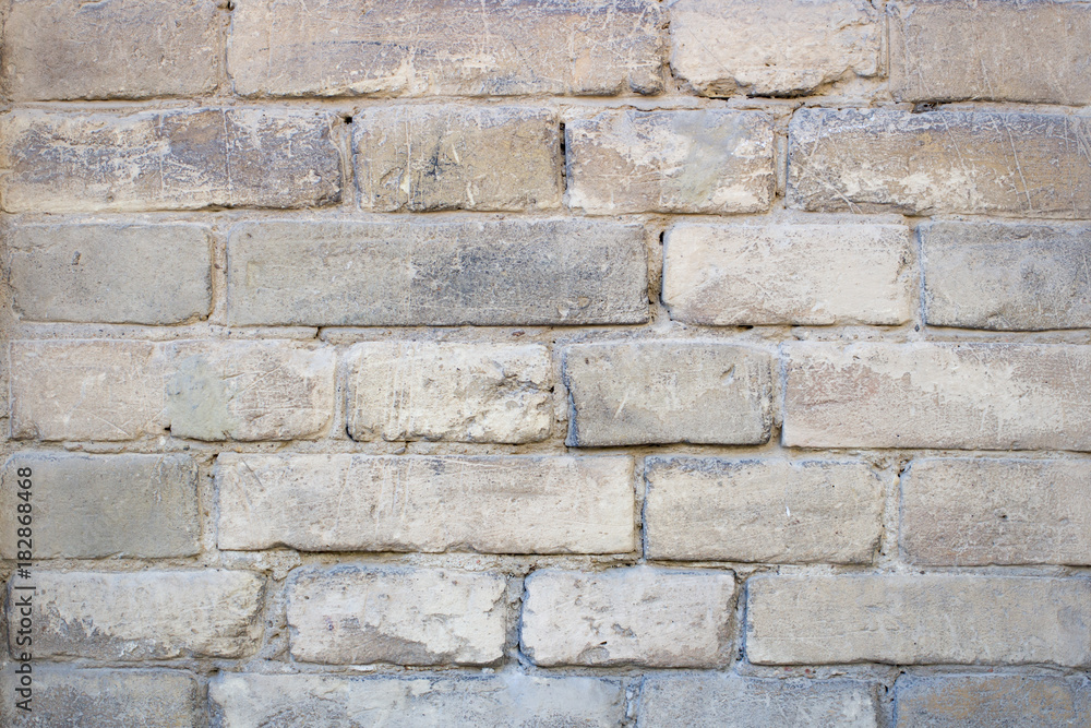 Yellow old brick wall background Yellow old brick wall background